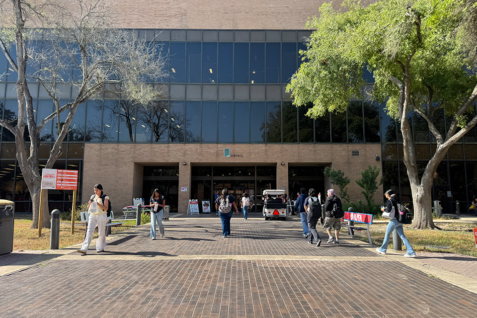 Students walk outside the University Library on the UTRGV Edinburg Campus on the first day of the Fall 2026 semester.
