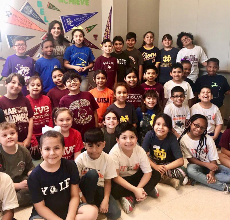 When UTRGV legacy alumna Margaret Medina-Olivarez, a McAllen native, asked universities around the country to send her their T-shirts so she could have a picture of her elementary school students wearing them, her request drew national attention. Olivarez has been a third-grade bilingual teacher at Pflugerville Independent School District’s Copperfield Elementary School for more than 10 years, after earning a bachelor’s degree in Interdisciplinary Studies with a concentration in education from UT Pan American. She is shown here with some of her students wearing the T-shirts garnered during her campaign to bring them awareness of higher education. (Courtesy Photo)