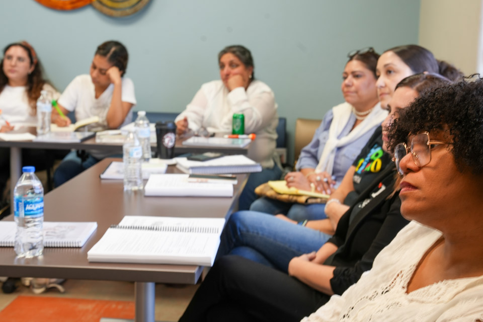Group of people sitting in a classroom during a training session