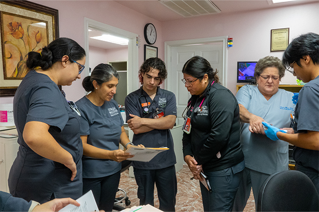 Nursing students review patient case files with Clinical Assistant Professor Vanessa Hale and Clinic Administrator Shirley Arnolde. L-R: Daniella Cuellar, Hale, Laert Musollari, Priscilla Olguin, Arnolde, and Kristoffer Azufra.(UTRGV photo by Karen Villarreal)