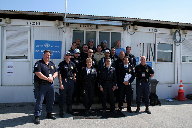 Sanchez (left) with UNMIK police administration leadership in Kosovo.