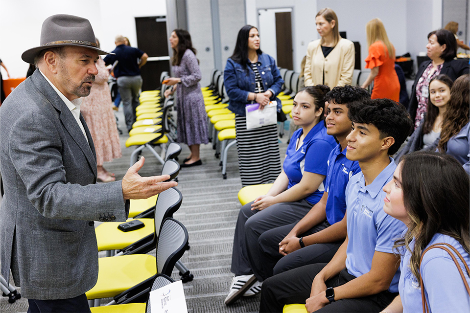 UTRGV President Bailey meets with South Texas ISD students after event.