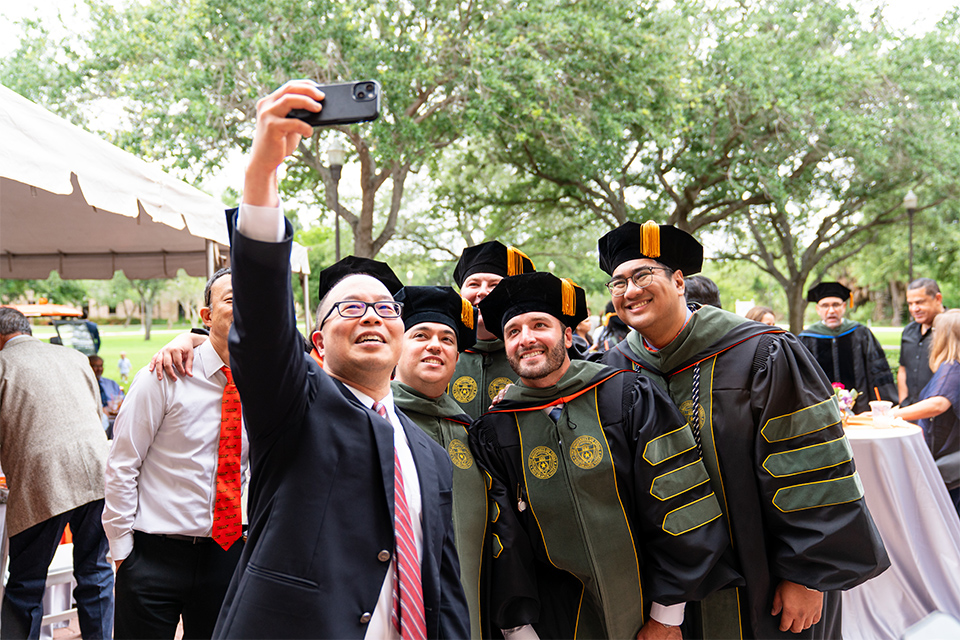 Group of friends celebrate graduation day. 
