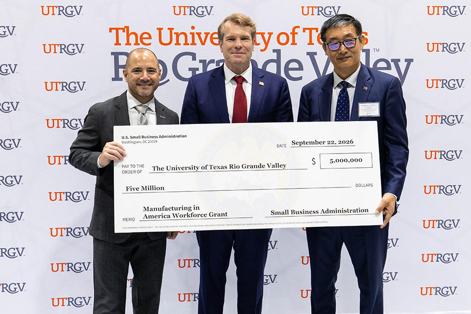 UTRGV and U.S. Small Business Administration representatives pose with a ceremonial $5 million grant check during a presentation at UTRGV.