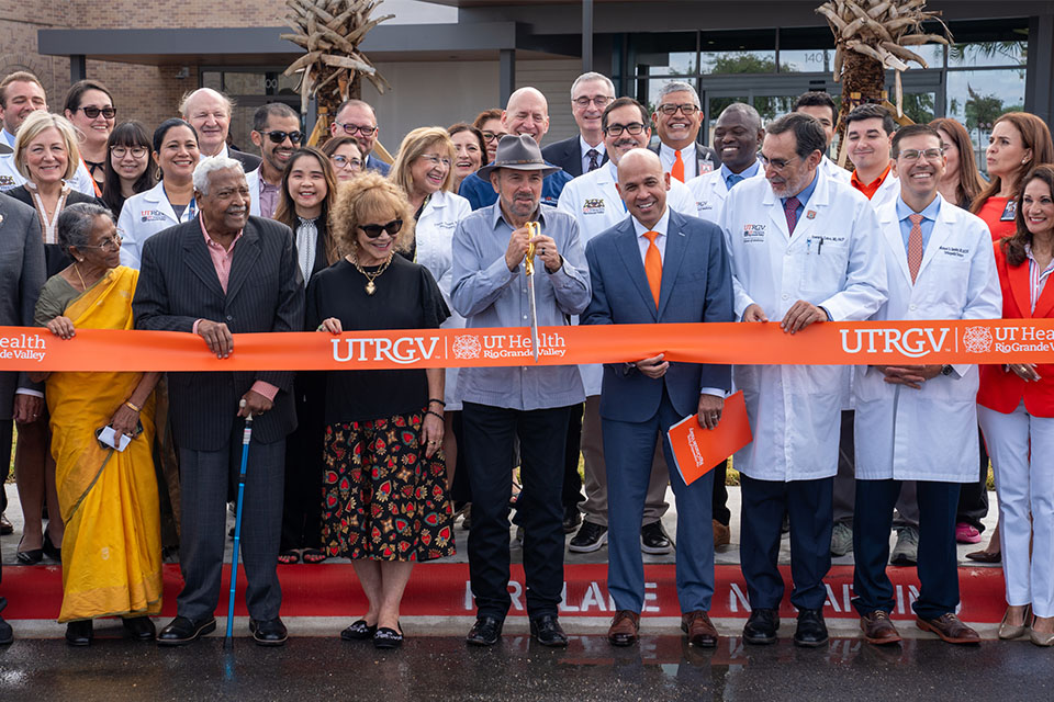 UTRGV President Guy Bailey cuts the ribbon during the ceremony at the UT Health RGV Cancer and Surgery Center.