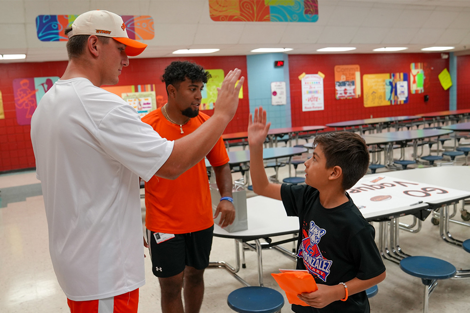 UTRGV Football players meet with the students at Cano/Gonzalez Elementary School to thank them for their support.