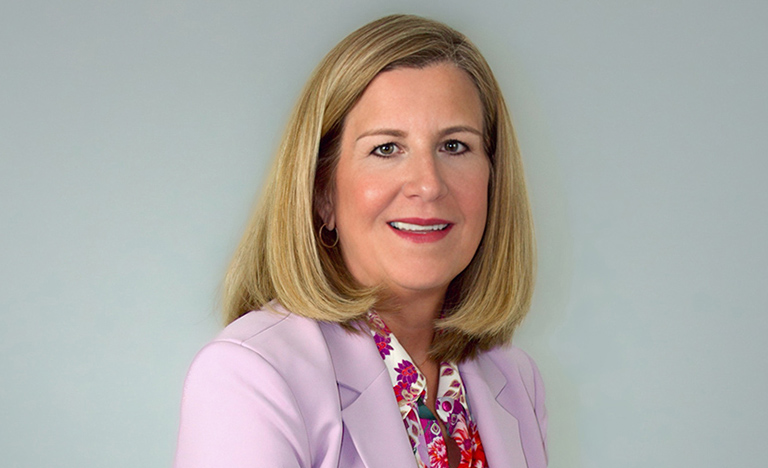 Dr. Magdalena Hinojosa smiles for a professional ...
