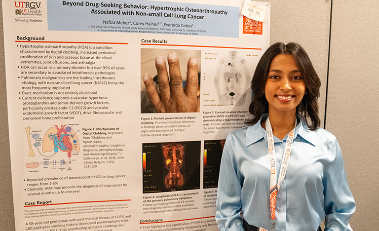 Nafiza Meher stands beside her research poster on ...