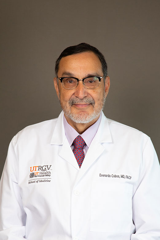 Headshot of Everardo Cobos, MD, FACP, dean of the UTRGV School of Medicine, wearing a white lab coat and patterned tie.