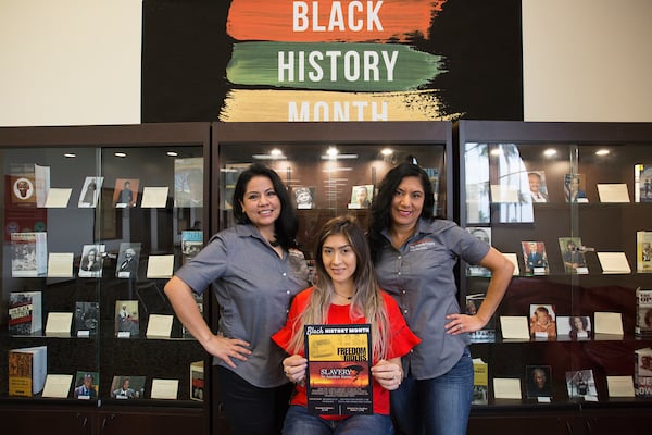 Thumbnail: Librarians pose for Black History Month photo.