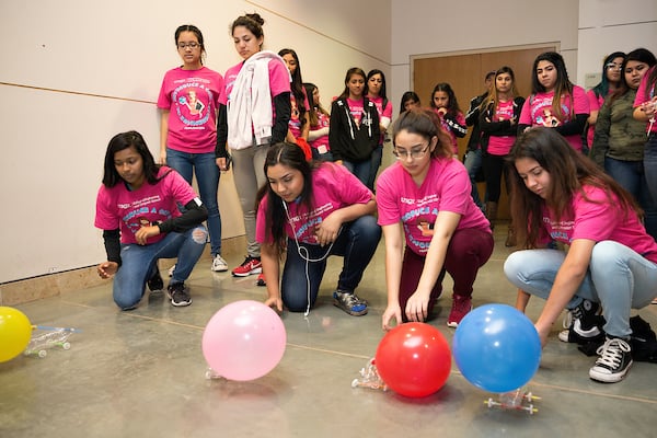 Students from area high schools race their balloon powered cars.