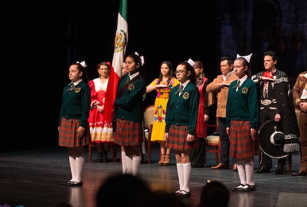 Mexican school marching flag squad.