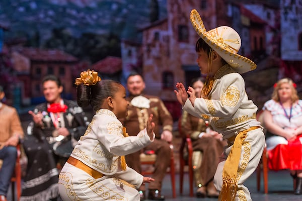 TSC Child Development Center kids perform on stage.