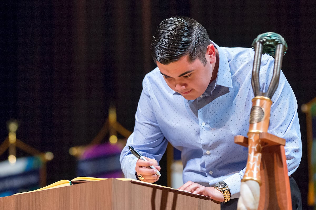 A student signs the register during the UTRGV Ring Ceremony.