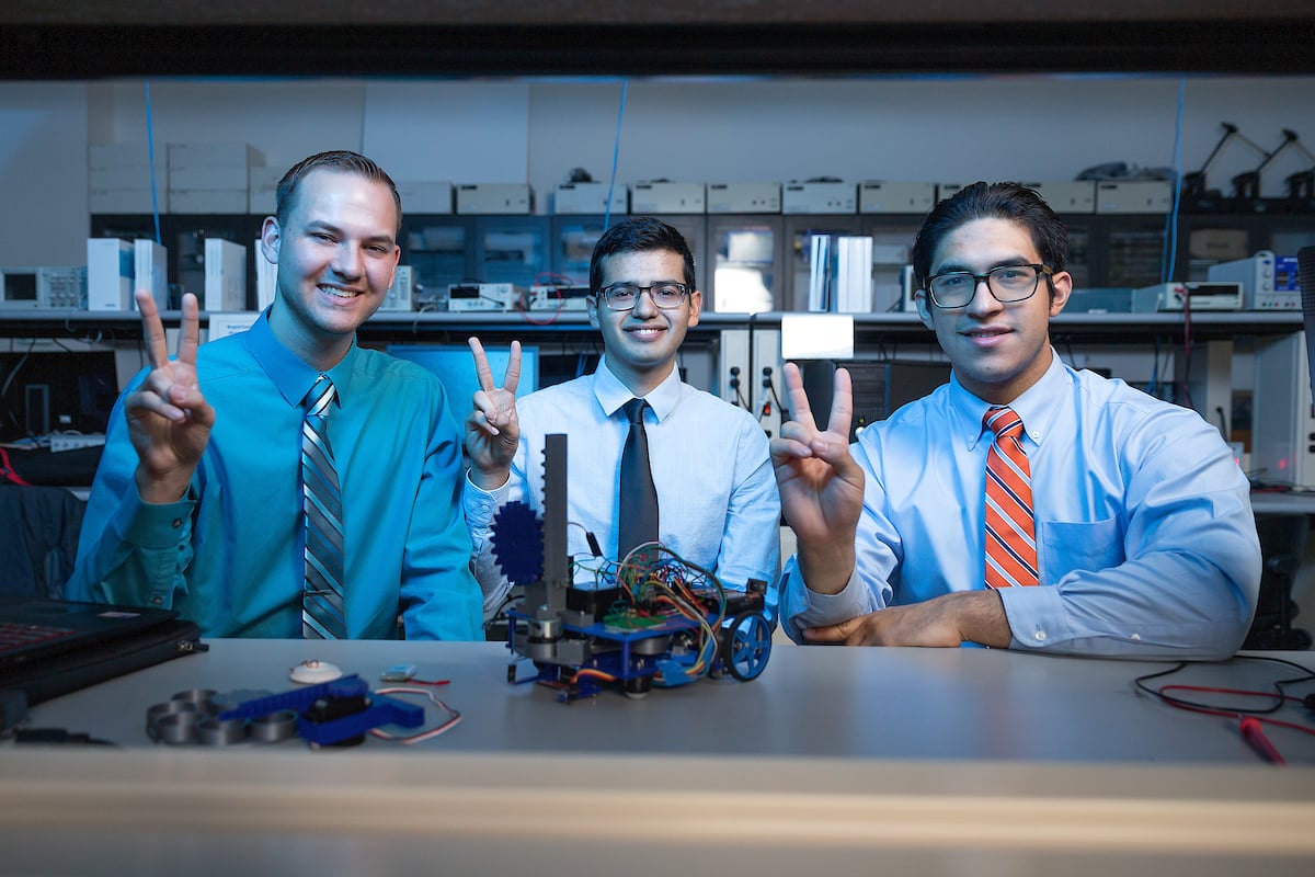 UTRGV Robotics Team with v's up.