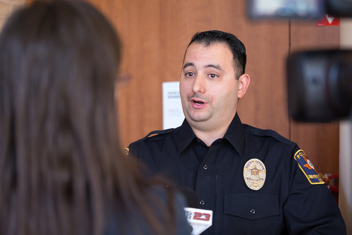 News media interviews UTRGV Police Officer David Pena.