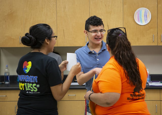 Team Mario summer camp student interacts with instructors.