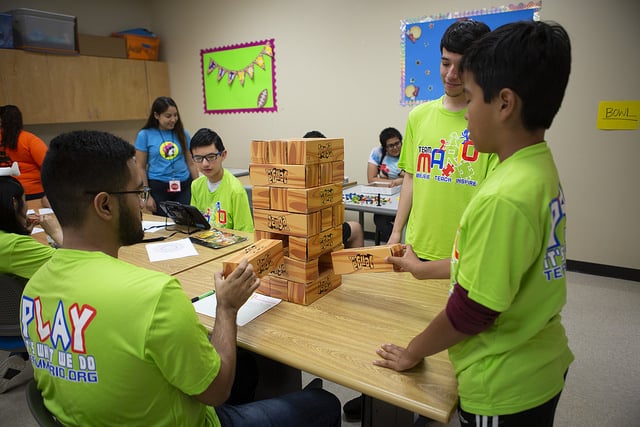 Game of jenga is being played.