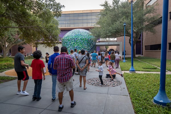 UTRGV H-E-B Planetarium attendees wait in line to observe the stars..