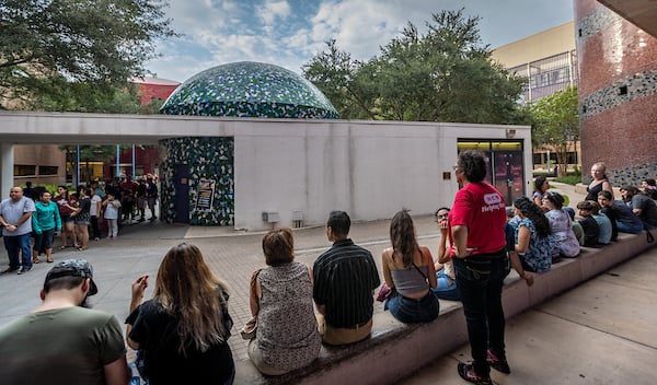 H-E-B Planetarium volunteer takes a look at crowd.