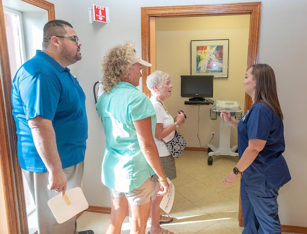 Guest recieve a tour of the Laguna Vista Clinic Ribbon and ask questions to guide.