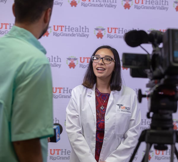 Thumbnail: White Coat Ceremony student being interviewed by Channel 4 news.