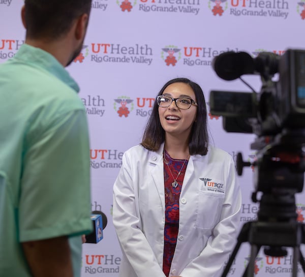 White Coat Ceremony student being interviewed by Channel 4 news.