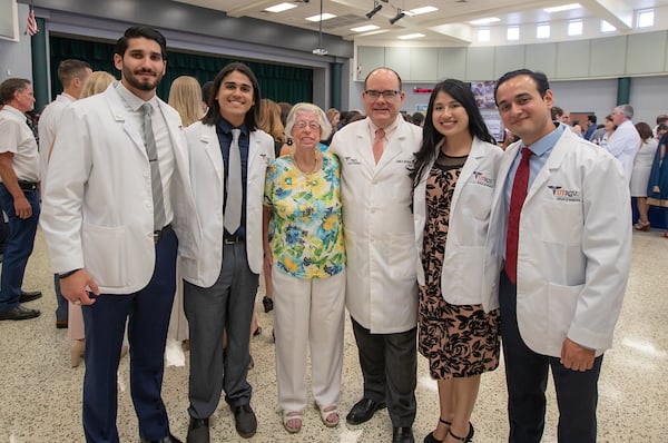 Friends and students posing with Dean.