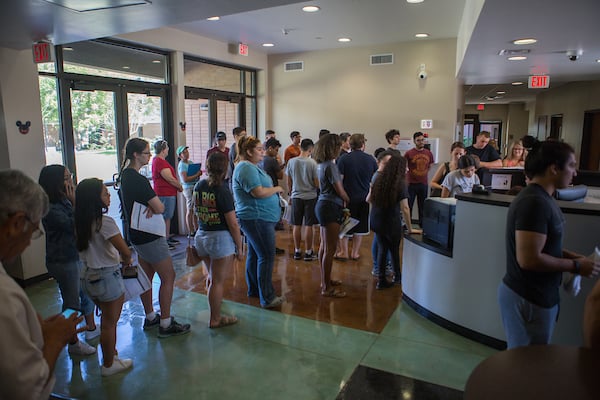 Freshman wait in line to check into Unity Hall.