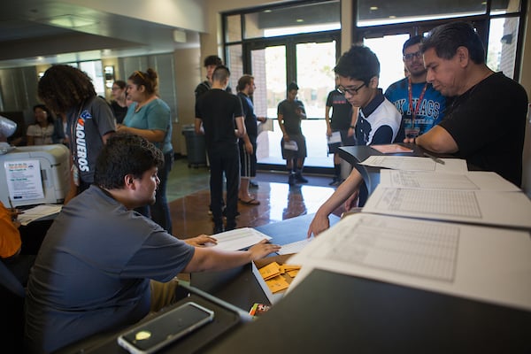 Clerk helps freshman to register.