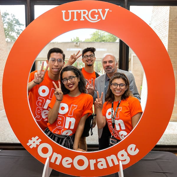 Street Team posing with university president for social media.