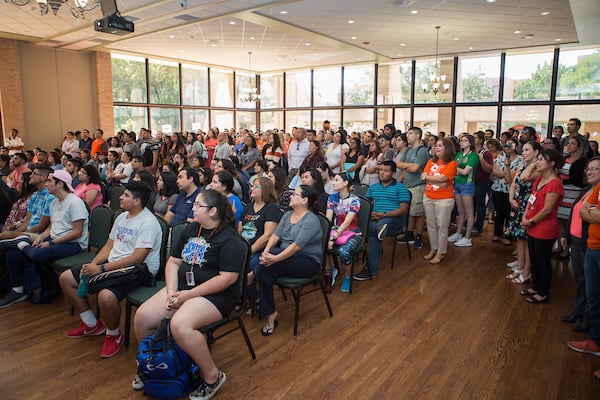 Thumbnail: Crowd sitting and standing on UTRGV Day.