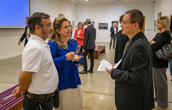 Professor Ping Xu interacts with visitors.