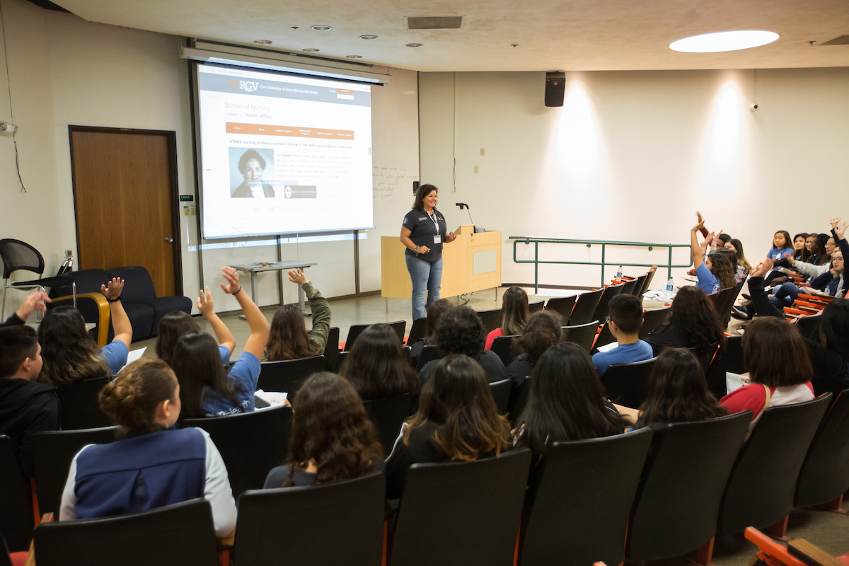 Faculty member speaks to students.