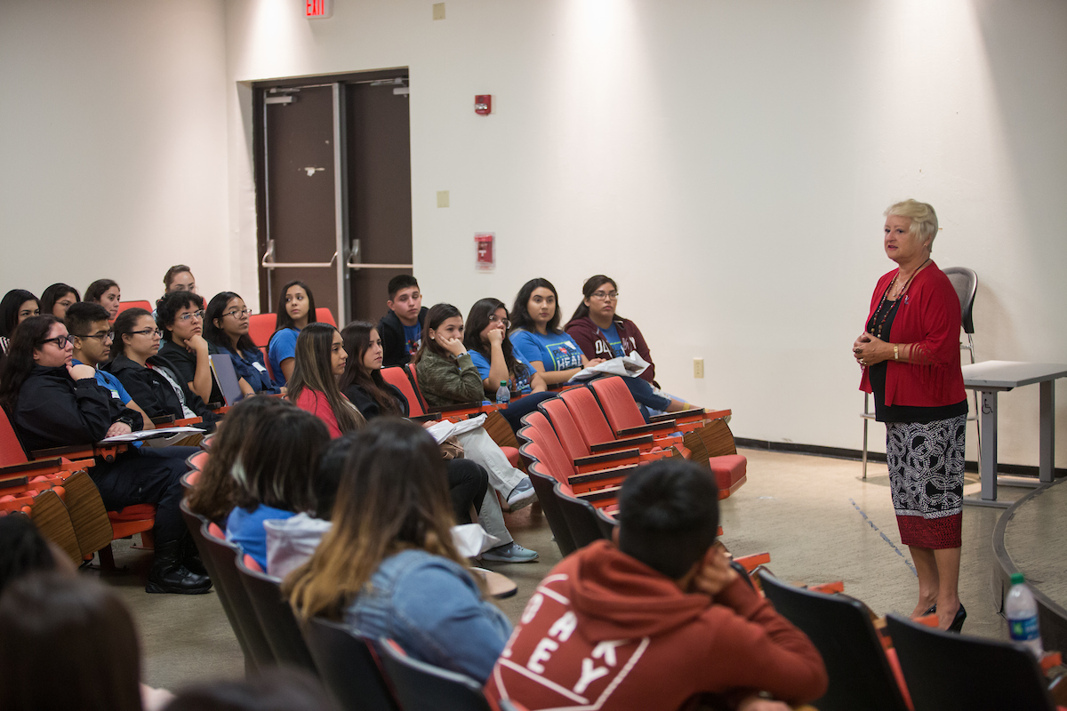 Faculty member speaks to students.