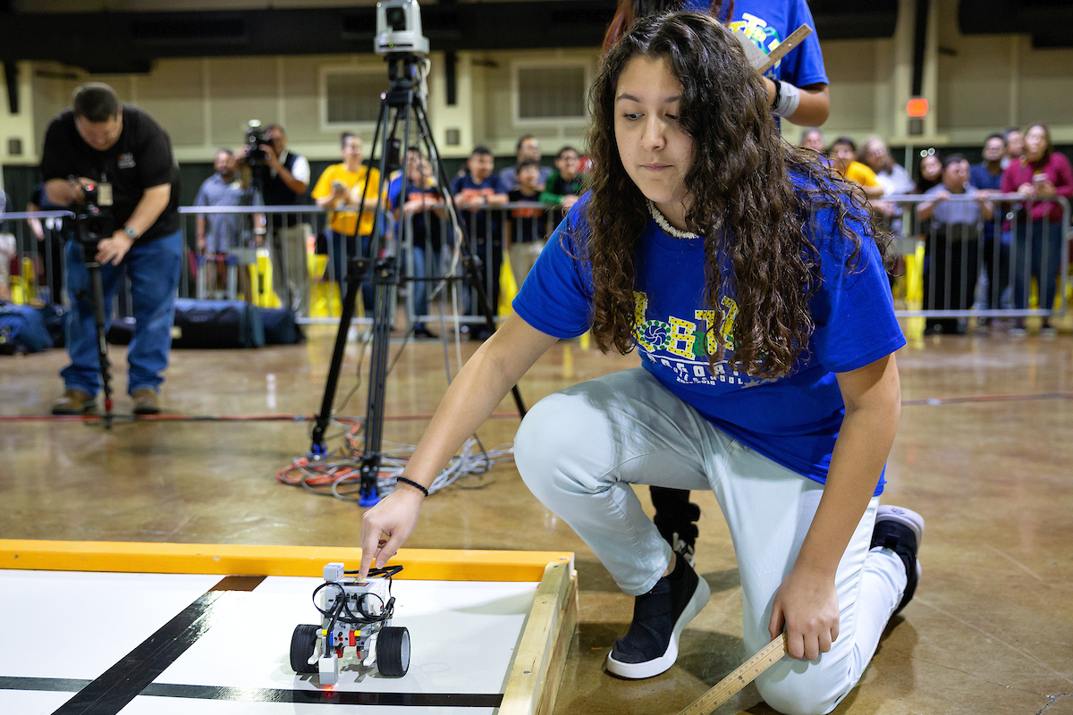 Team member starts her robot.