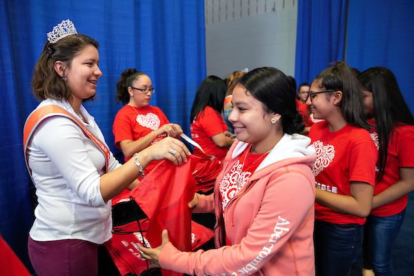 Students receive goody bags at start of event.