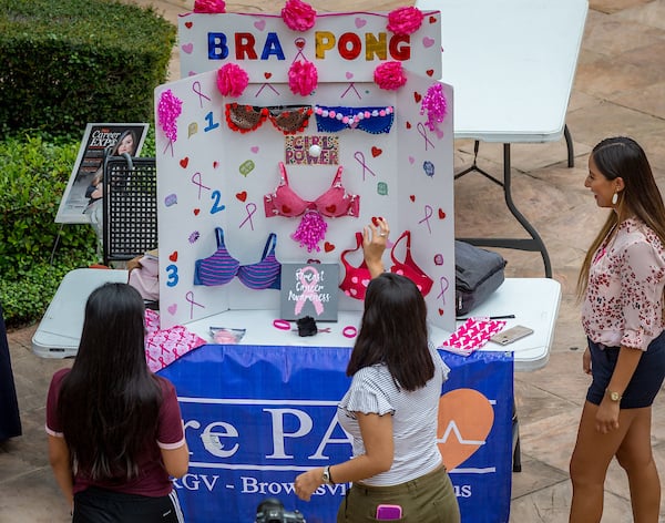 A group of students play bra pong.