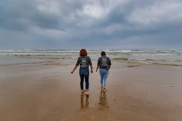 a pair of high school students walking to the gulf