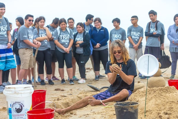 Instructor from Sandy Feet teaches sandcastle construction