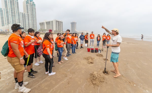 Instructor from Sandy Feet teaches sandcastle construction