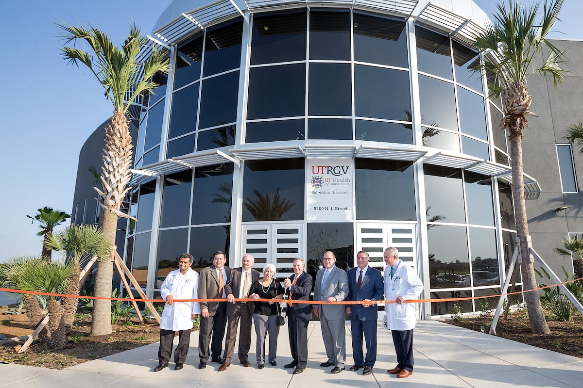ribbon cutting in front of building