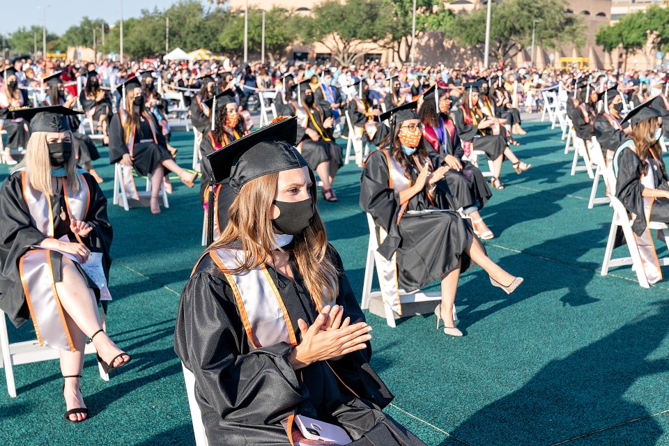UTRGV graduates seated in chairs spaced six feet apart