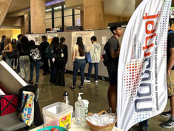 NovaRhet 2024   Students standing by table display at NovaRhet 2026