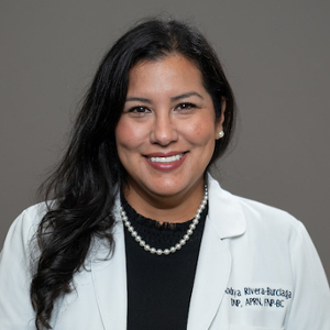 Smiling, faculty portrait.