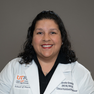 Smiling, faculty portrait.