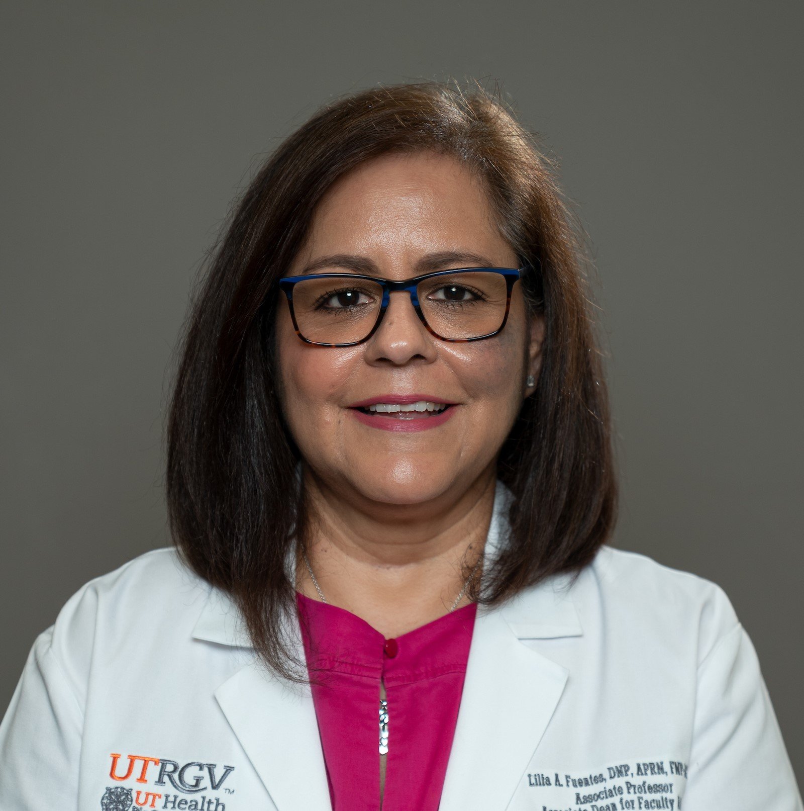 Smiling, faculty portrait.