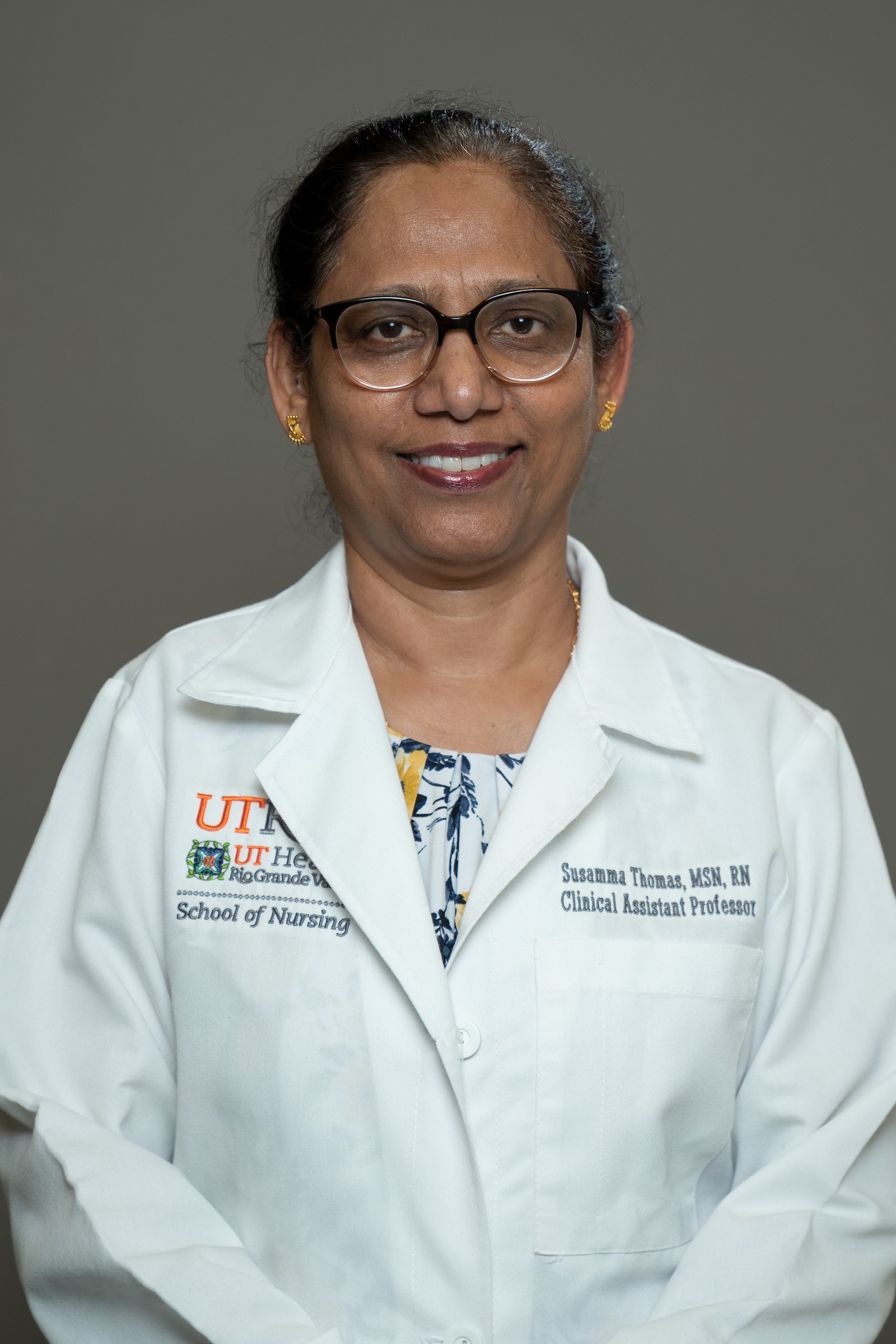 Smiling, faculty portrait.
