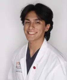 Student posing for photo while smiling.