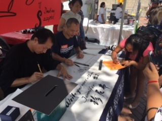 Teachers handwriting Chinese language at Fiesta De Palmas in McAllen